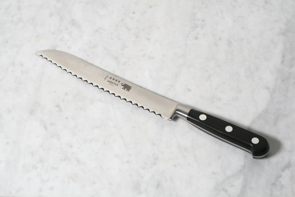 https://flotsamandfork.com/cdn/shop/products/SabatierBreadKnifeBlack_1024x1024.jpg?v=1605477435