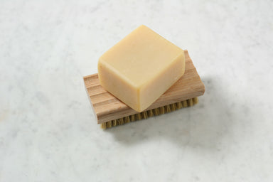 An oiled beechwood soap dish, with ridged surface, that does double duty as a nail brush. From Burstenhaus Redecker.